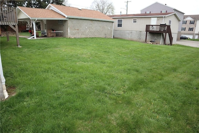 view of yard with a wooden deck