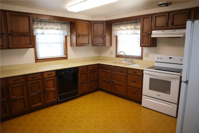 kitchen with white appliances and sink