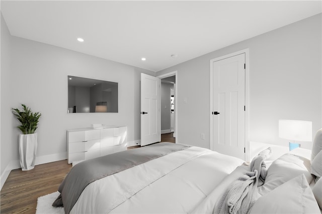 bedroom featuring dark hardwood / wood-style floors