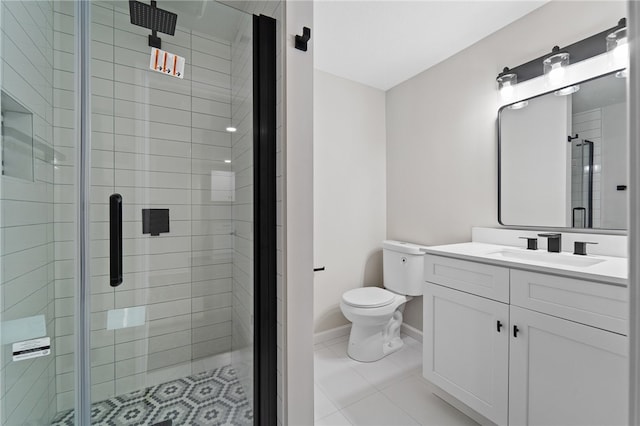 bathroom featuring vanity, toilet, tile patterned floors, and a shower with door