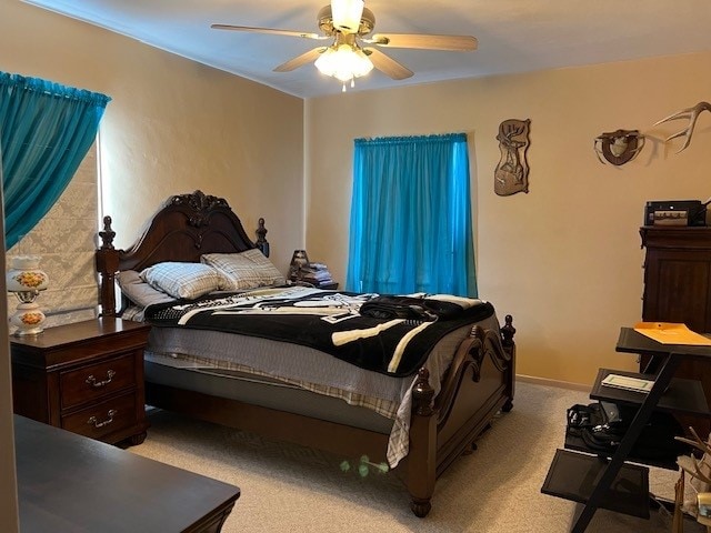 bedroom with light colored carpet and ceiling fan