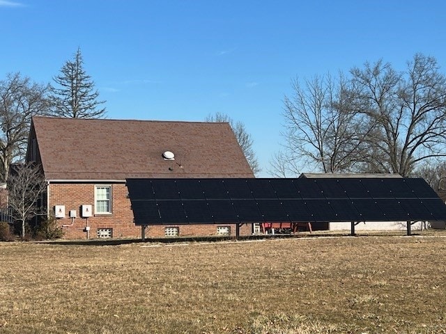 view of home's exterior with a lawn