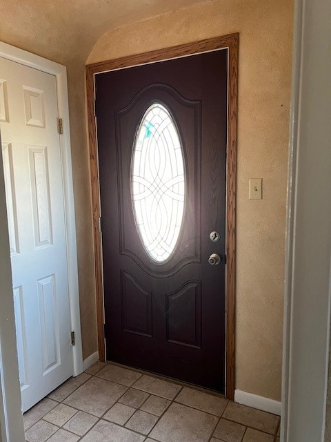 foyer entrance with light tile floors