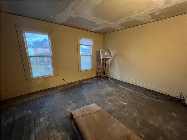 unfurnished room featuring dark hardwood / wood-style floors