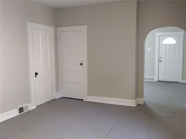 unfurnished room featuring hardwood / wood-style floors