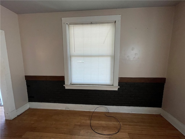 empty room featuring hardwood / wood-style flooring