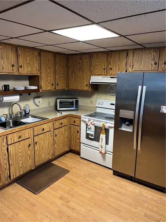 kitchen with stainless steel fridge, electric stove, light hardwood / wood-style floors, and a drop ceiling