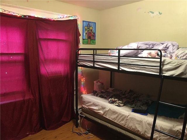 bedroom featuring hardwood / wood-style floors