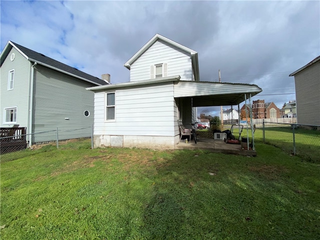 back of property featuring a yard and a patio area