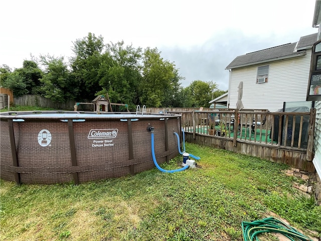 view of yard with a fenced in pool