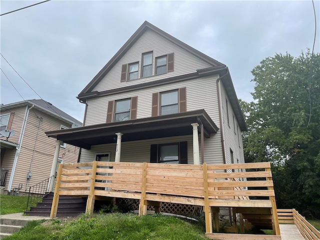 view of front of property with a wooden deck