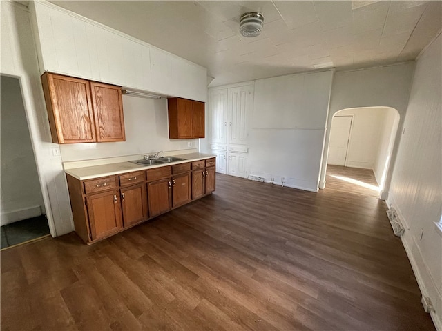 kitchen with sink and dark wood-type flooring