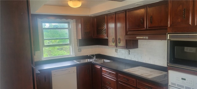 kitchen with dishwasher, black microwave, sink, and a wealth of natural light