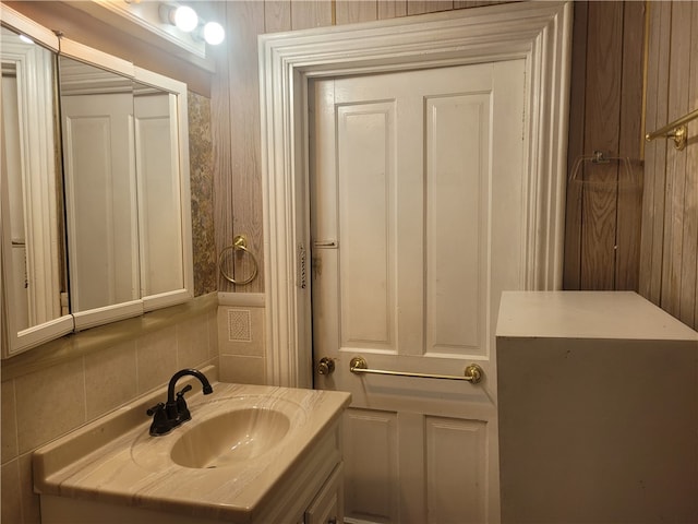 bathroom with oversized vanity and tasteful backsplash