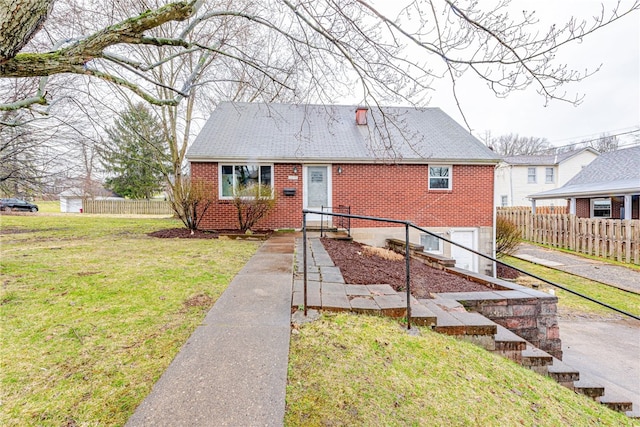 bungalow-style home with a front yard