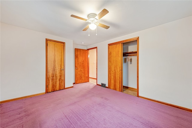 unfurnished bedroom featuring a closet, light carpet, and ceiling fan