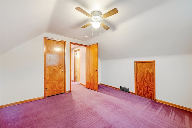 bonus room with light carpet, ceiling fan, and vaulted ceiling