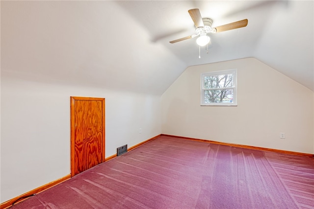 bonus room with carpet floors, ceiling fan, and lofted ceiling