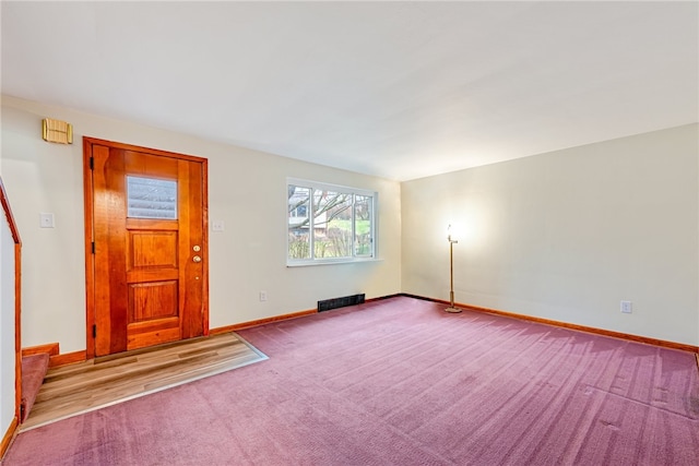 view of carpeted entrance foyer