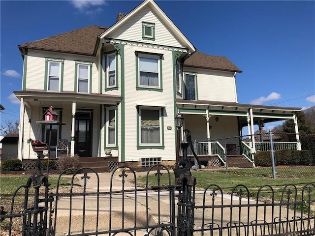 victorian-style house featuring a porch