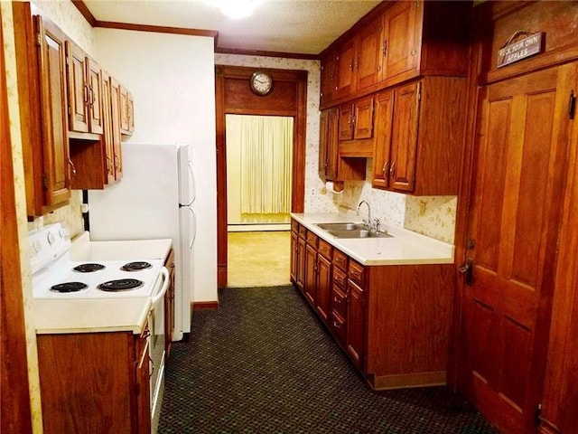 kitchen with white electric range oven, a baseboard heating unit, sink, dark tile flooring, and tasteful backsplash