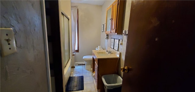 bathroom with tile patterned floors, toilet, vanity, and a shower with shower door