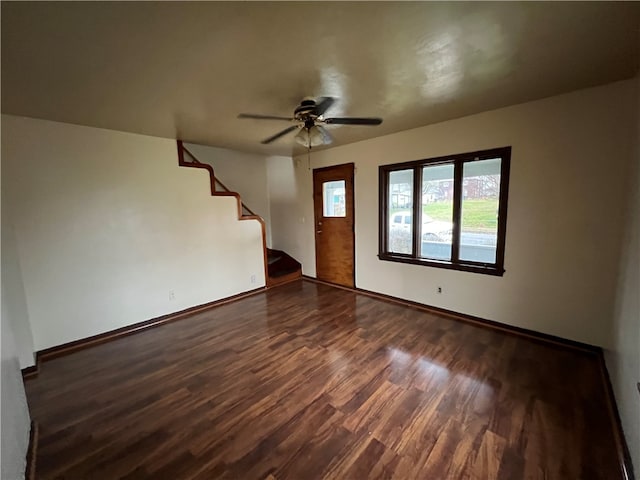 spare room featuring ceiling fan and dark hardwood / wood-style floors