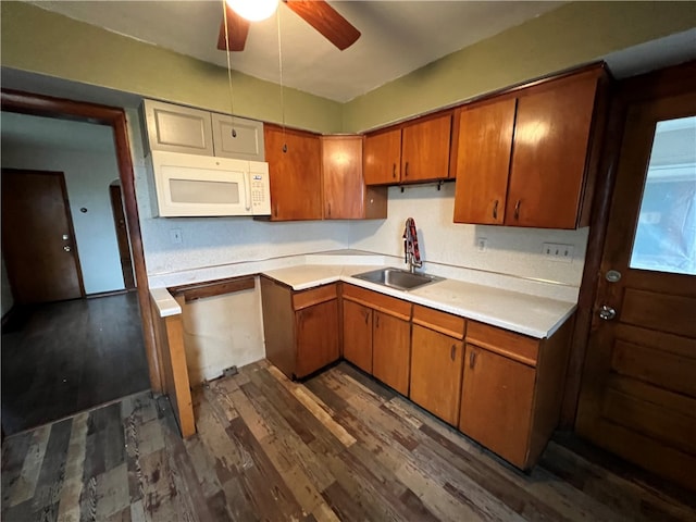 kitchen featuring sink, dark hardwood / wood-style floors, and ceiling fan