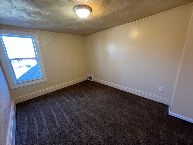 empty room featuring carpet flooring