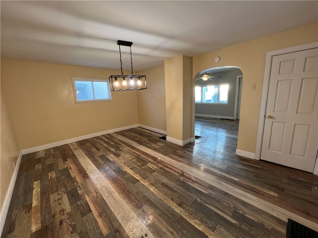 unfurnished room featuring ceiling fan and dark hardwood / wood-style flooring