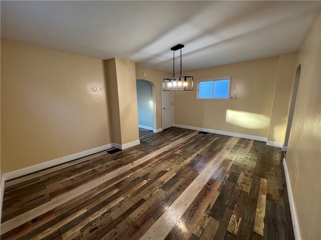 unfurnished dining area with dark hardwood / wood-style floors