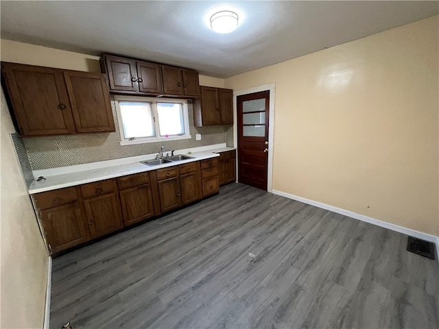 kitchen with sink and light hardwood / wood-style floors