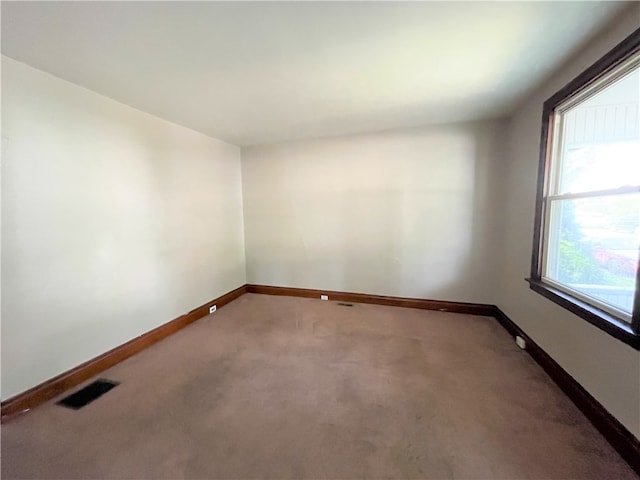 unfurnished room with carpet floors