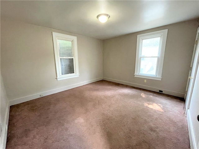 unfurnished room with light colored carpet