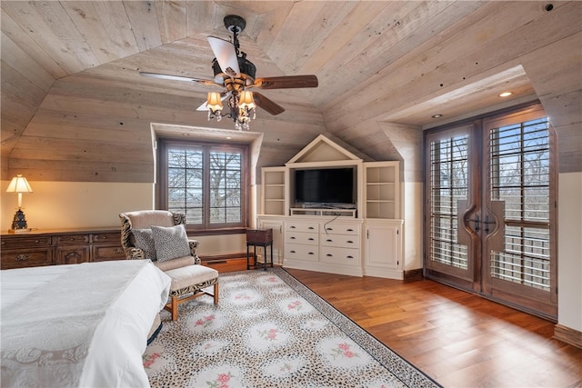 bedroom featuring light hardwood / wood-style floors, wooden ceiling, ceiling fan, and lofted ceiling