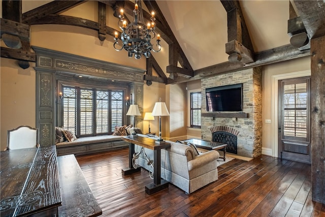 living room with plenty of natural light, a stone fireplace, and dark hardwood / wood-style floors