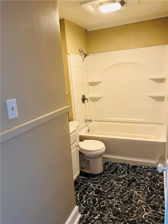 full bathroom featuring toilet, tile flooring, vanity, and tub / shower combination