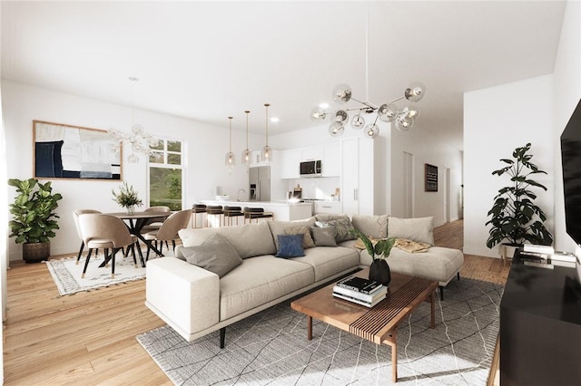 living room featuring light hardwood / wood-style flooring and a notable chandelier