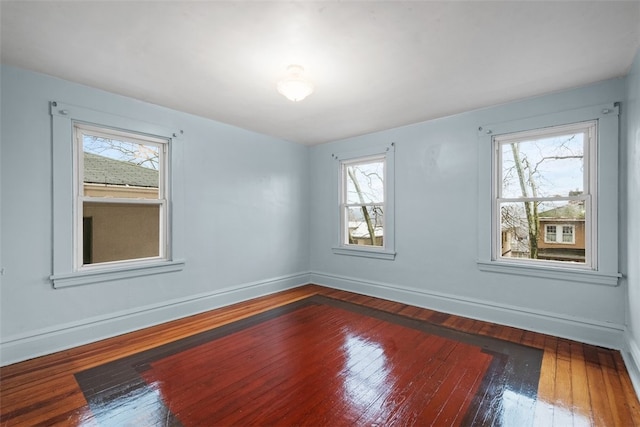 unfurnished room featuring dark hardwood / wood-style floors