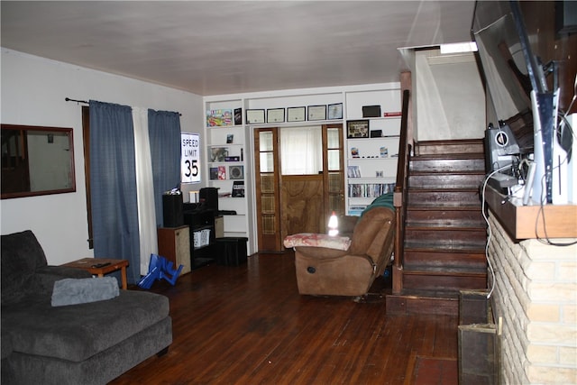 living room with dark hardwood / wood-style flooring