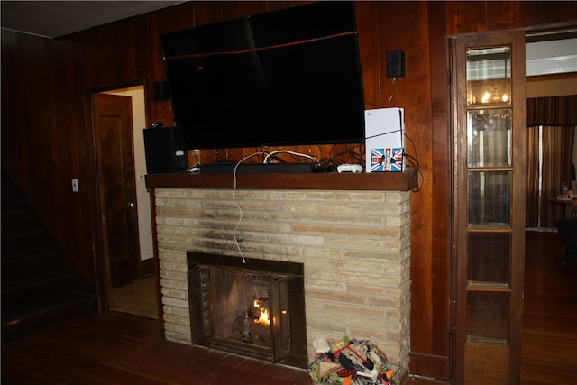 interior space featuring dark hardwood / wood-style floors and a brick fireplace