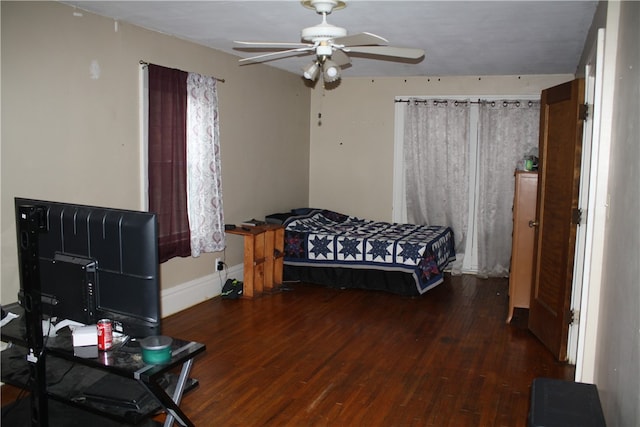 bedroom featuring dark hardwood / wood-style floors and ceiling fan