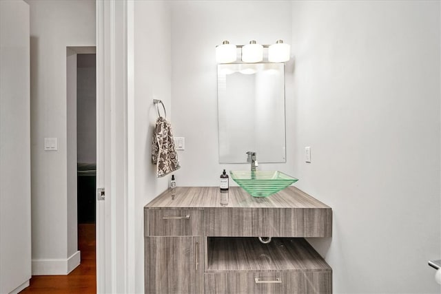 bathroom featuring sink and hardwood / wood-style flooring