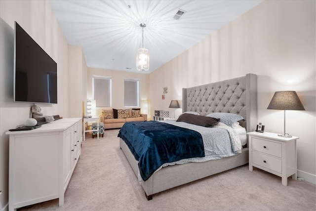 bedroom featuring light colored carpet