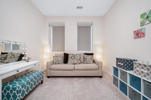 bedroom featuring light carpet