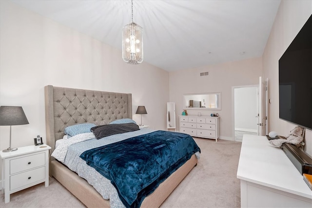 carpeted bedroom with an inviting chandelier