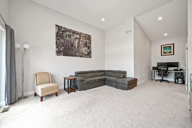 sitting room featuring light colored carpet