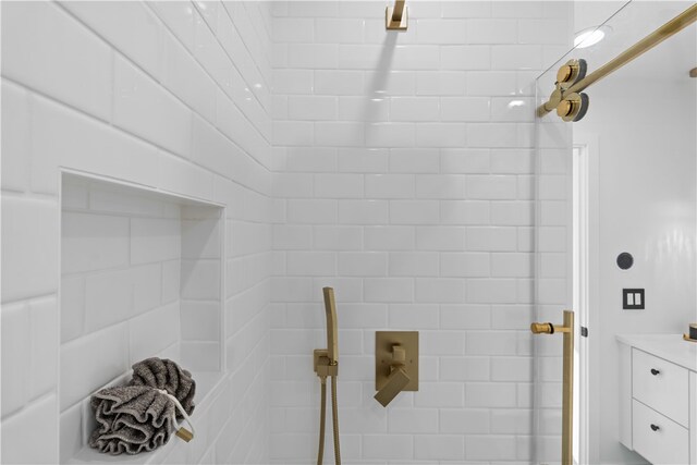 bathroom with a tile shower