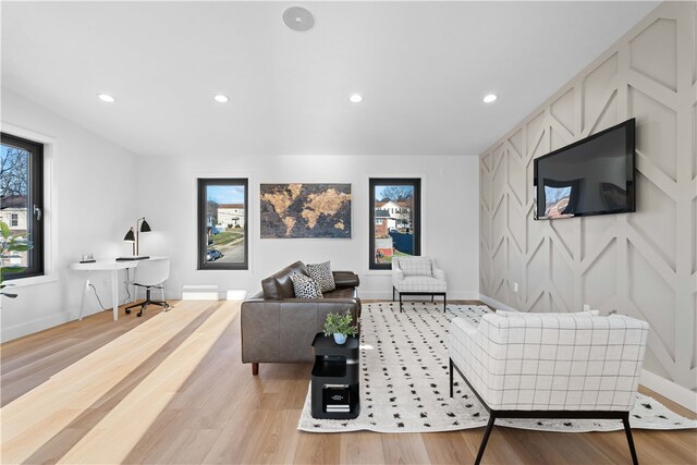 living room with light hardwood / wood-style flooring