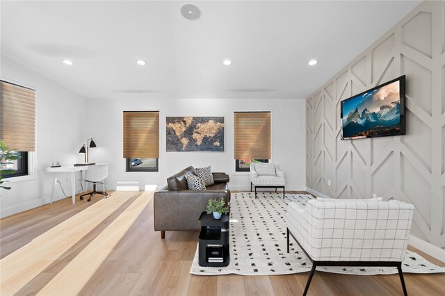 living room with light hardwood / wood-style flooring